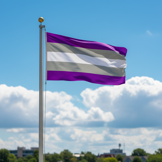 A purple, white, and gray striped flag waving on a silver flagpole against a bright blue sky with white clouds.