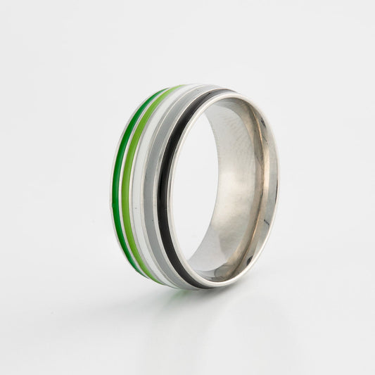 Silver ring with aromantic pride flag colored stripes on a white background