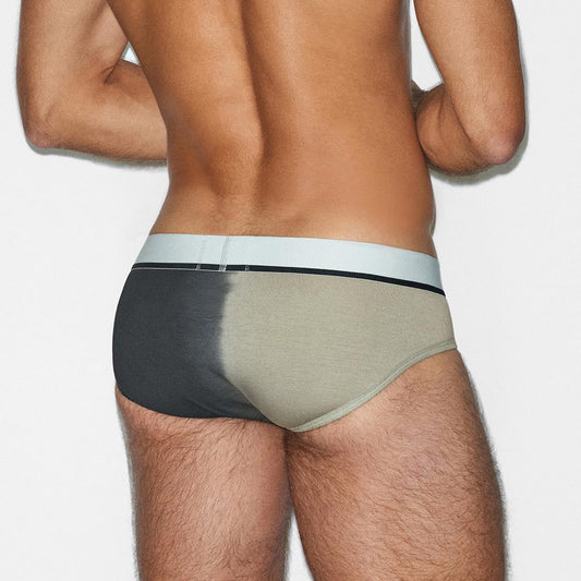 Man wearing a two-tone underwear with a gradient from black to beige on a white background