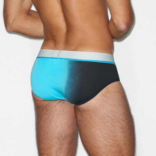 Man wearing a black and blue underwear set on a white background