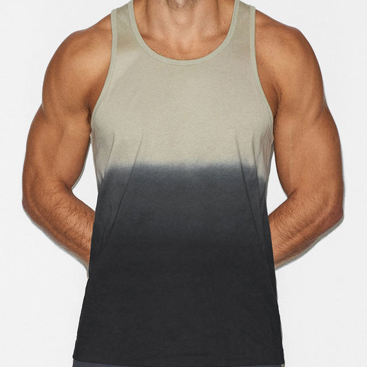 Man wearing a gradient tank top with beige on top and black on bottom against a white background