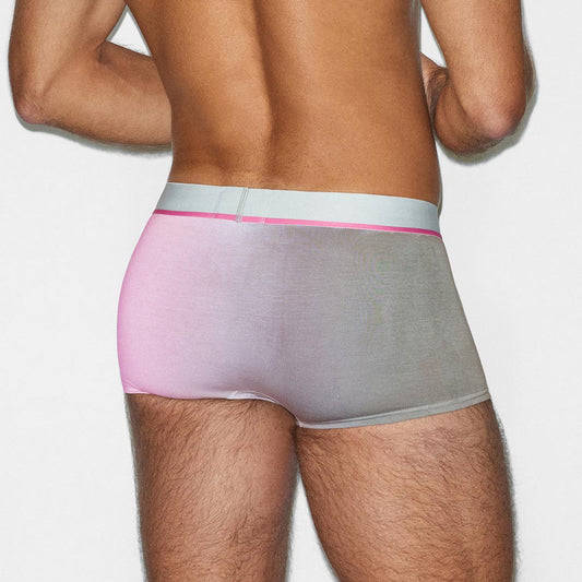 Person wearing a gray and pink underwear set on a white background