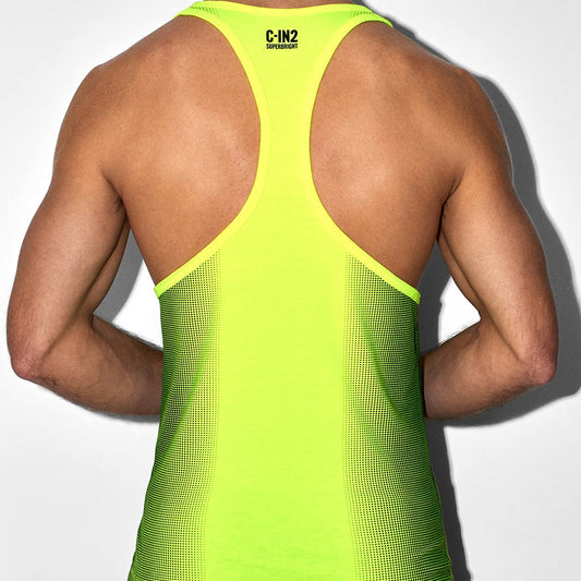 Person wearing a bright green tank top with 'C-IN2' branding on a white background