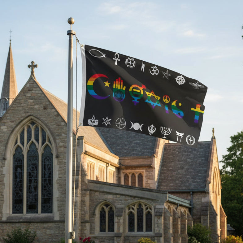 Flag with multiple different religious symbols and the word 'COEXIST' on a black background being flown from a flagpole in front of place of worship building