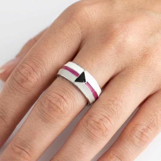 a hand wearing a ring with a demisexual pride flag design