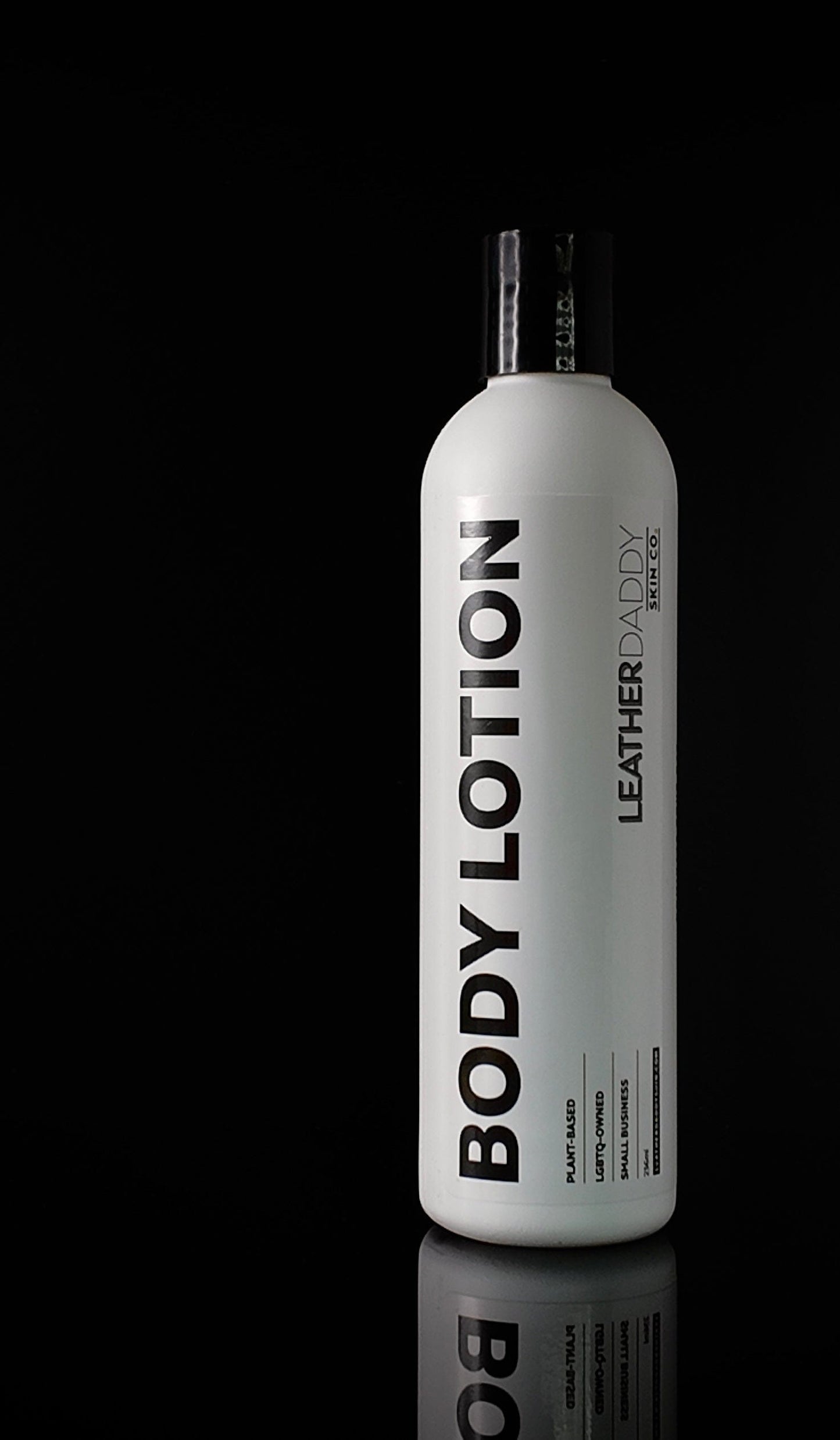 white bottle with black lettering with Body Lotion and Leather Daddy branding