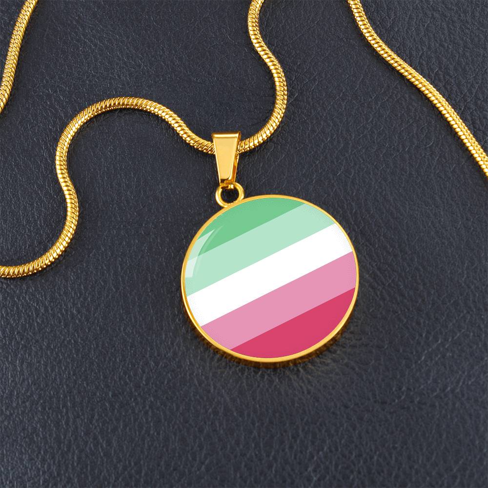 Abrosexual Pride Circle Pendant Necklace gold-on-table