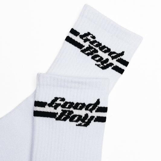 White socks with black 'Good Boy' text in black on a white background