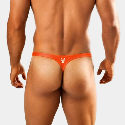 Man wearing an orange thong against a white background
