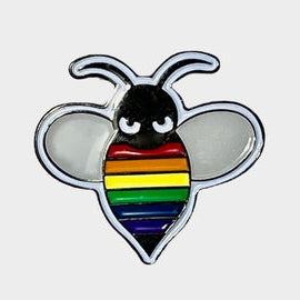 Enamel pin shaped like a bee with lgbt rainbow pride colors on a white background
