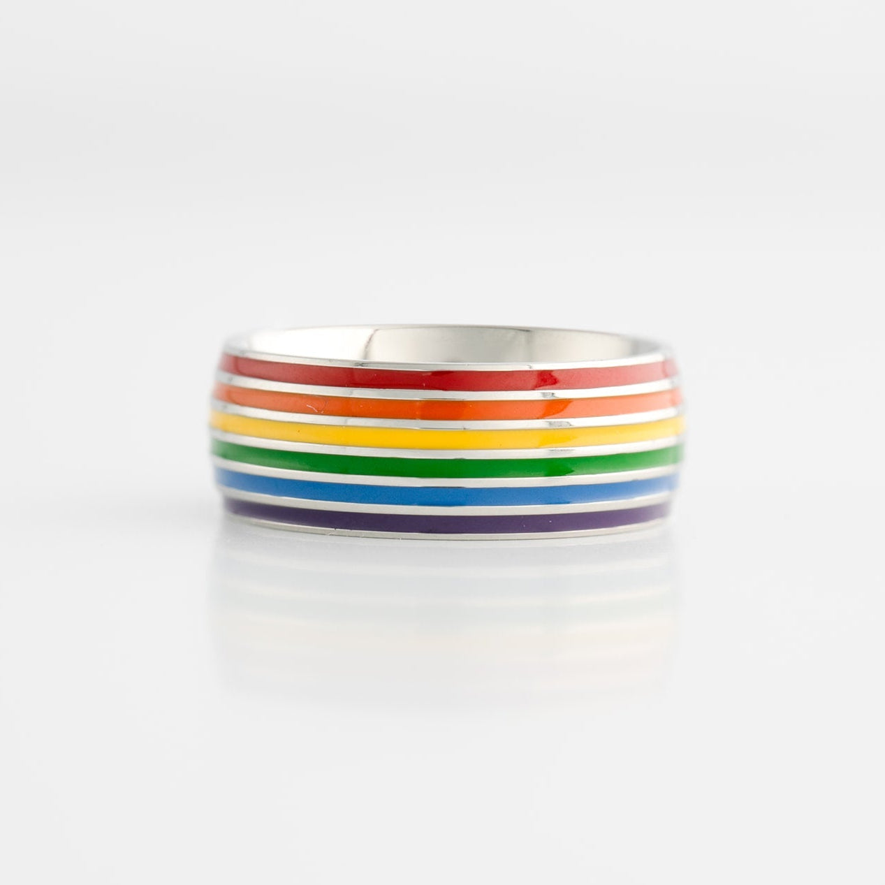 Ring with lgbtq pride rainbow stripes on a white background