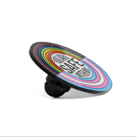 Colorful lapel pin with a black base on a white background