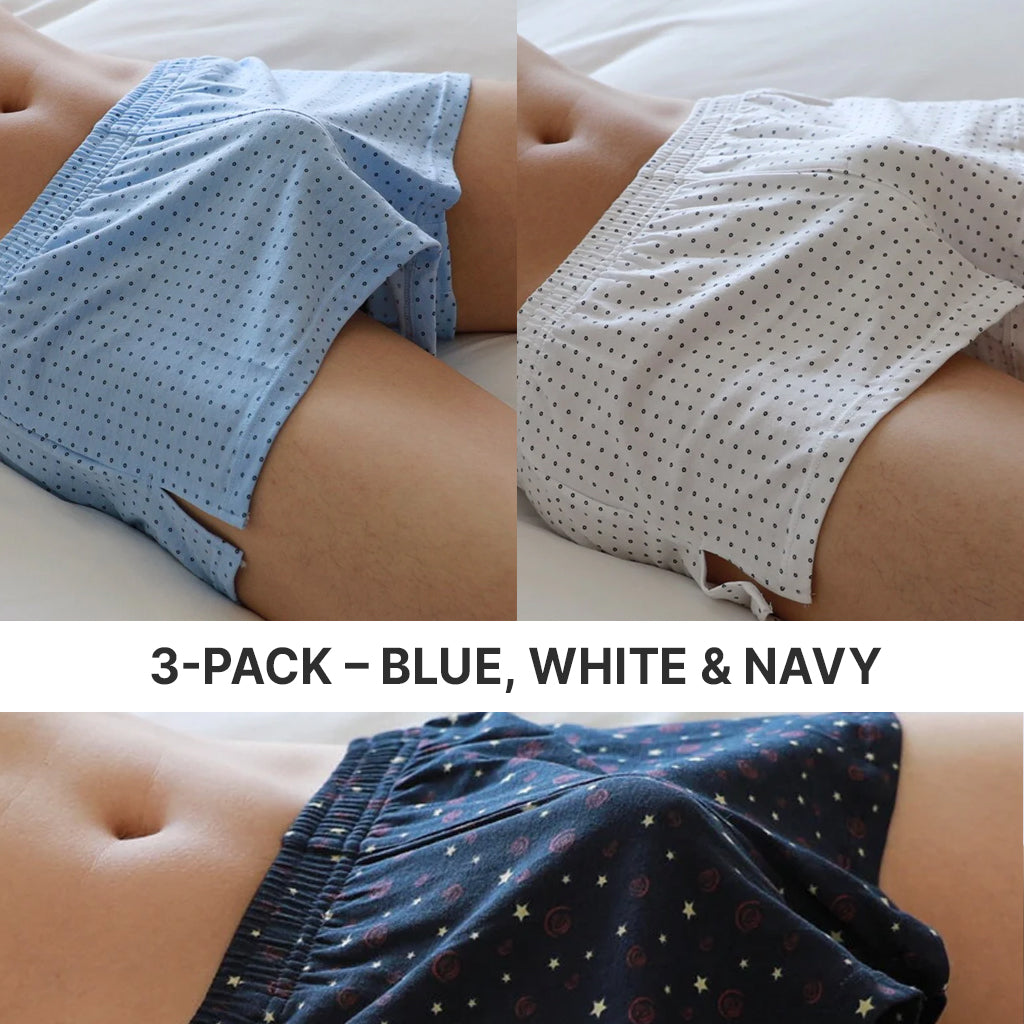 Three pairs of polka dot boxer shorts in blue, white, and navy on a neutral background.