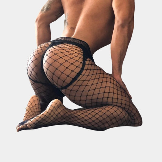 man wearing black fishnet stockings on a plain background