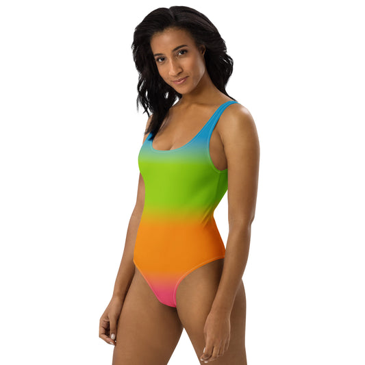 Woman wearing a panromantic pride gradient swimsuit on a white background