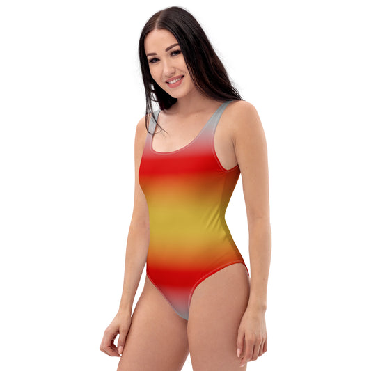 Woman wearing a proculsexual pride gradient swimsuit on a white background