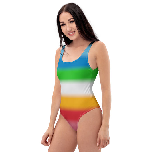 Woman wearing a queer pride striped swimsuit on a white background