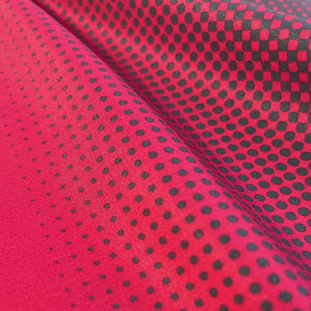 Red fabric with black polka dots
