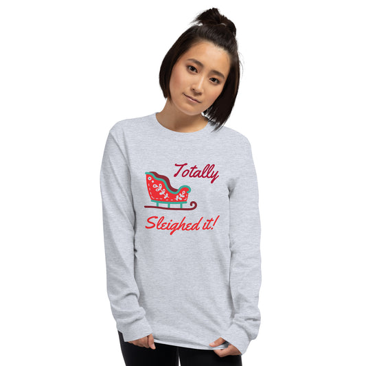 person wearing a grey long sleeve tee shirt with a red holiday sleigh and red text that reads 'Totally Sleighed it!'