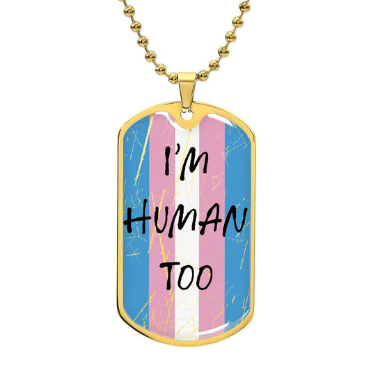 A gold necklace with a pendant featuring the transgender pride flag colors and the text 'I'm Human Too'.