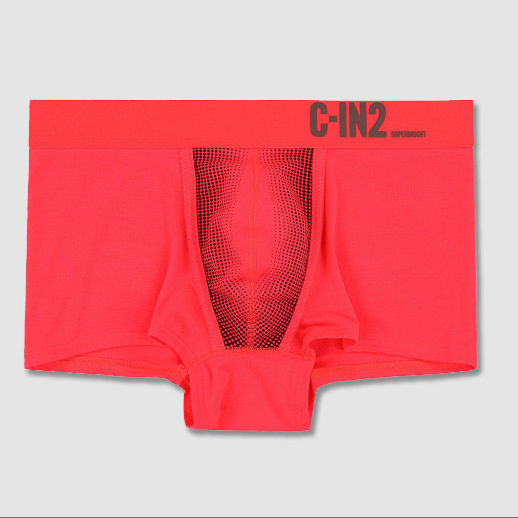 Bright coral pink boxer briefs with a black mesh center panel and 'C-IN2' printed in black on the waistband, shown flat on a light gray background.