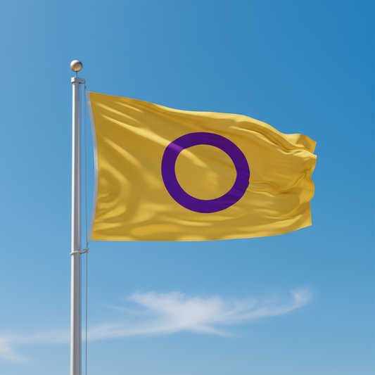 A yellow intersex flag with a large purple ring symbol, attached to a silver flagpole and waving against a clear blue sky with light clouds.