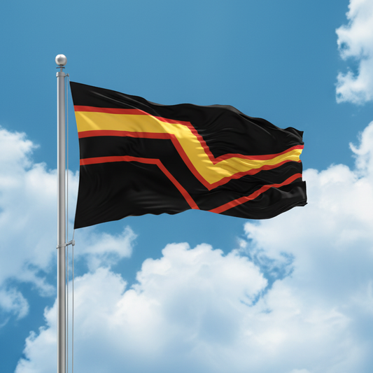 A black flag with bold yellow and red chevron-like stripes waving on a silver flagpole against a blue sky with white clouds.