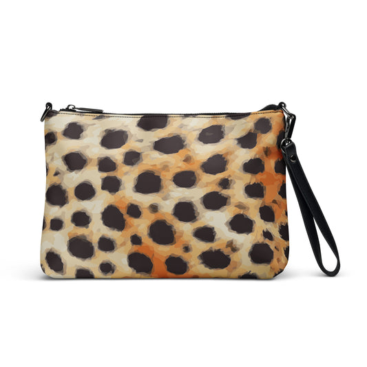 A clutch purse with an abstract cheetah print in shades of brown, black, and white, featuring black hardware and a zip-top closure.