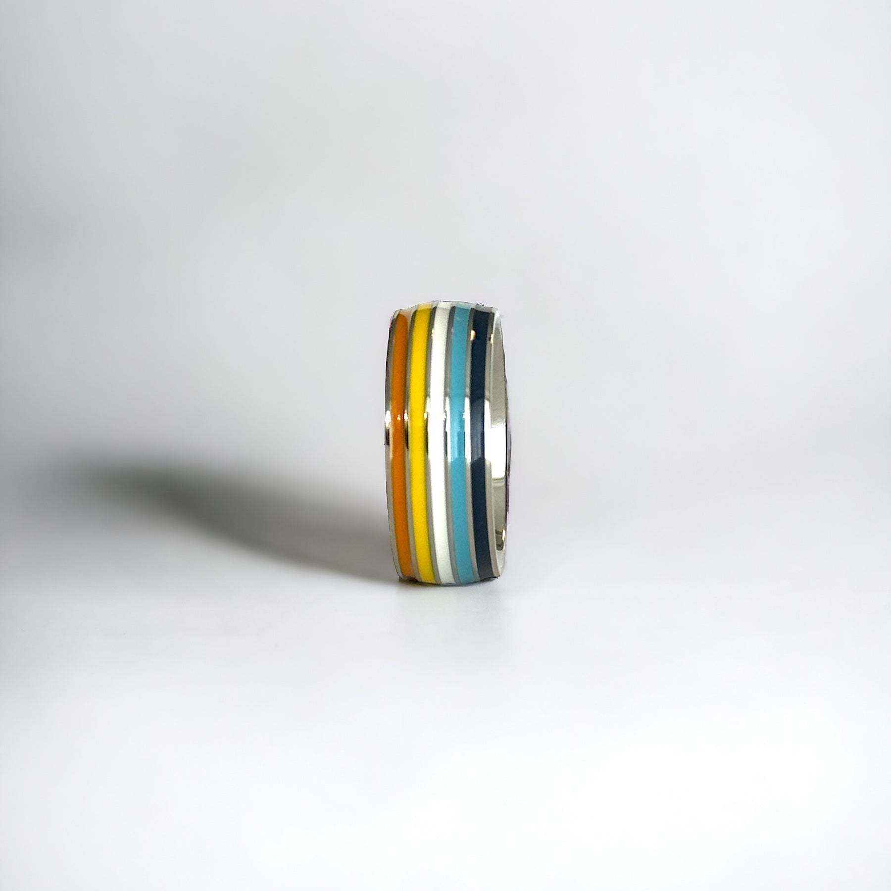 Silver ring with Aroace pride stripes on a white background