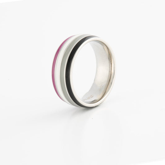Silver ring with ace pride stripes on a white background