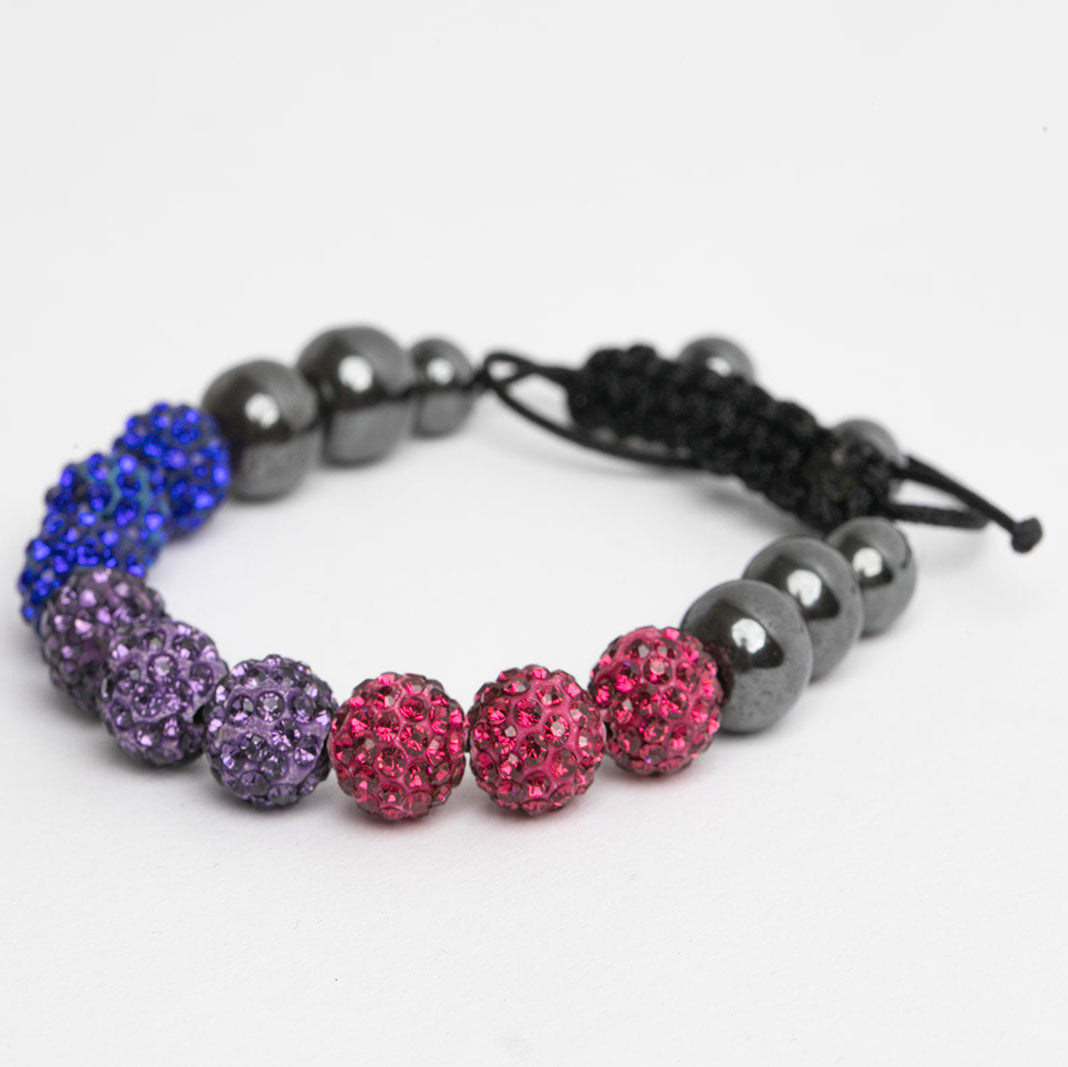 Bracelet with bisexual pride colored beads on a white background