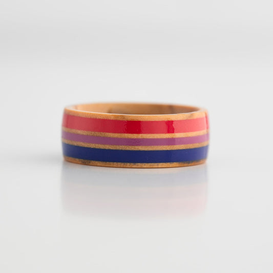 Bi Pride ring with red, blue, and purple stripes on a white background