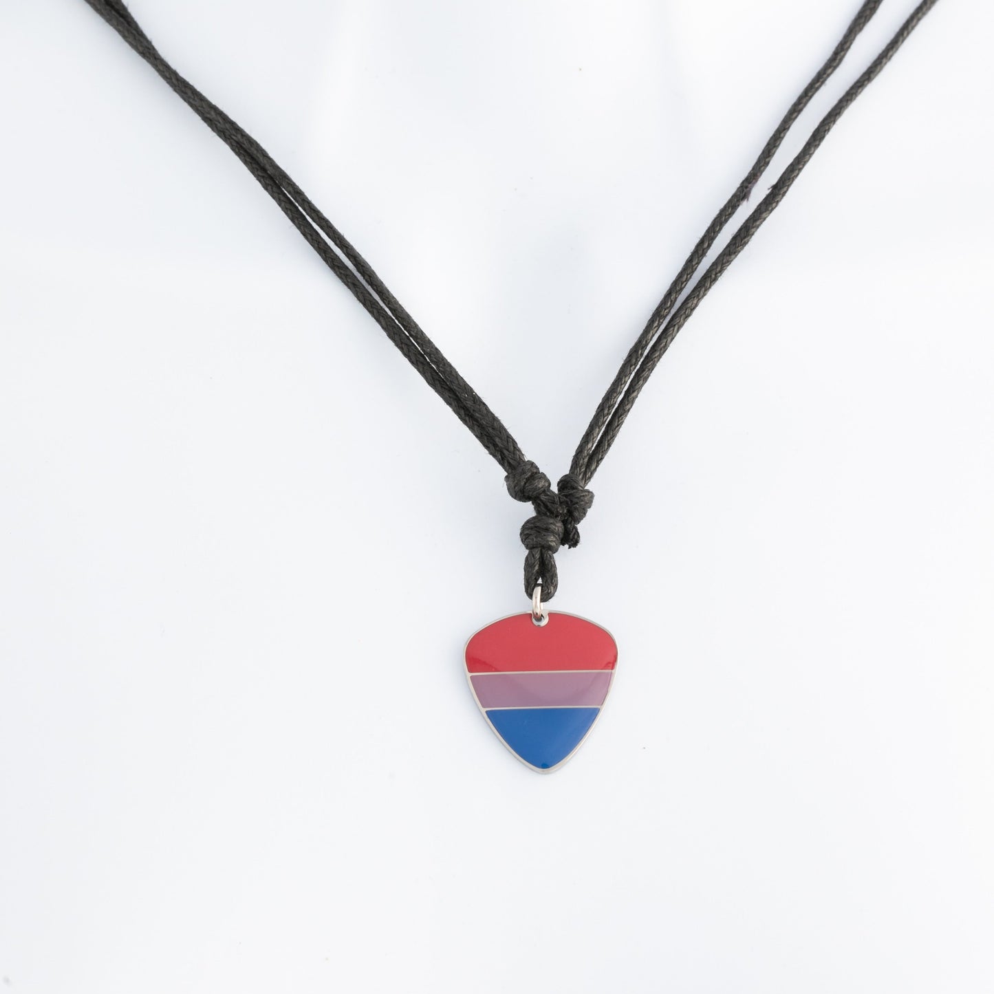 Necklace with a bisexual pride flag guitar pick pendant on a white background