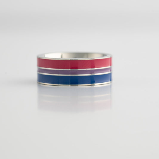 Ring with bisexual pride flag stripes on a light gray background