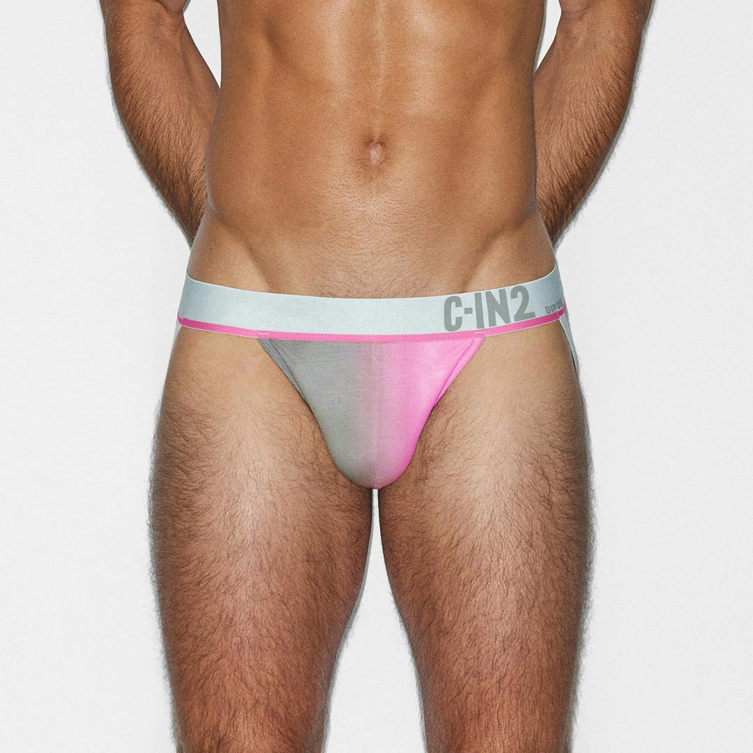 Man wearing a pink and gray men's jockstrap with 'C-IN2' brand logo on a white background