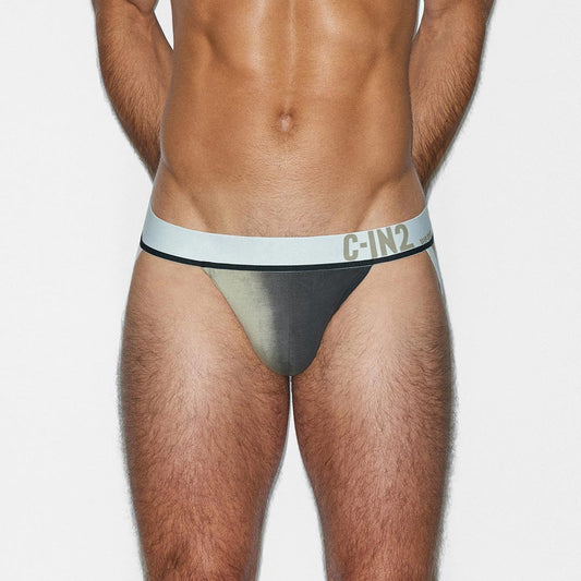 Man wearing a black and beige men's jockstrap with 'C-IN2' branding on a white background