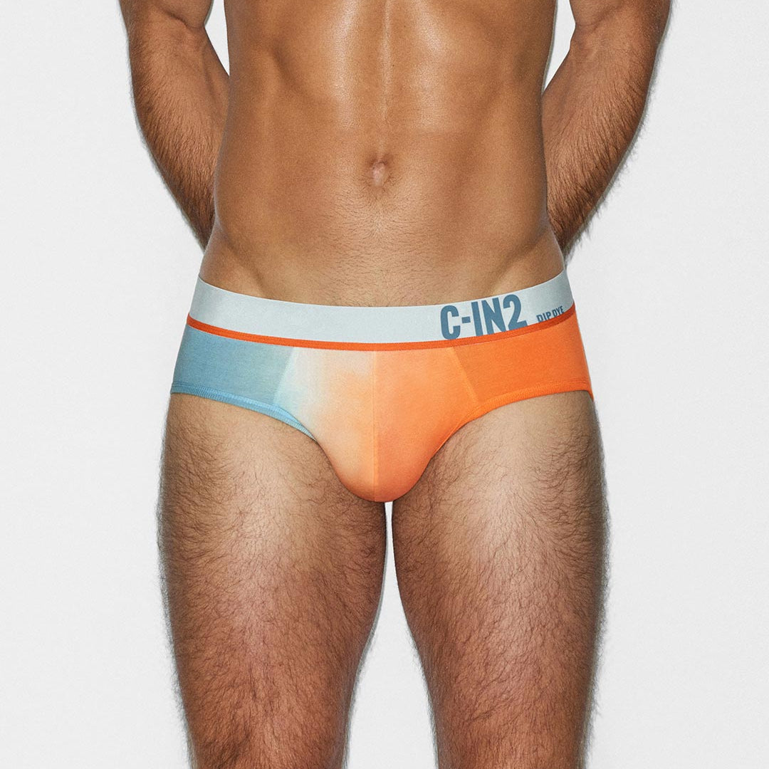 Man wearing a colorful men's underwear with 'C-IN2' brand logo on a plain background