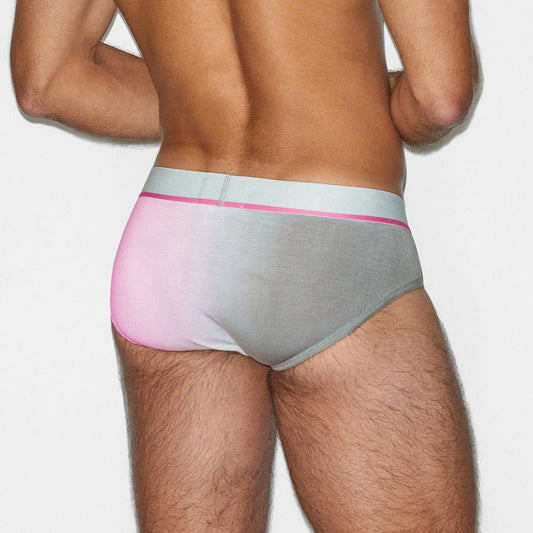 Man wearing a gray and pink underwear set on a white background