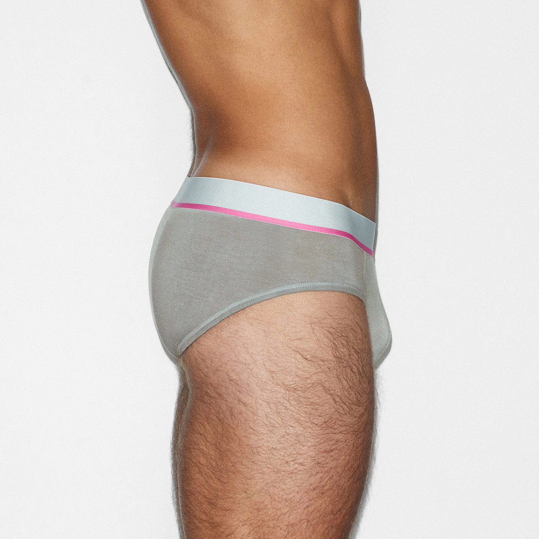 Gray underwear with a pink waistband on a white background