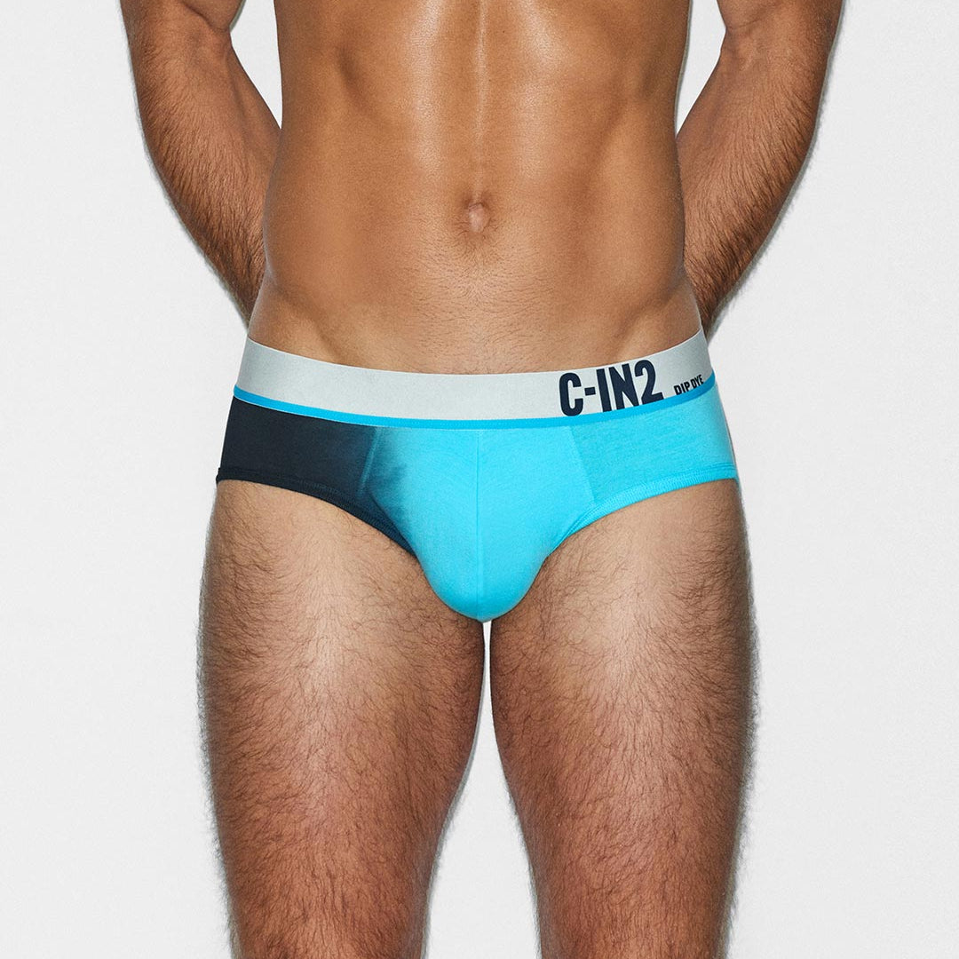 Man wearing a blue and black underwear with 'C-IN2' branding on a white background