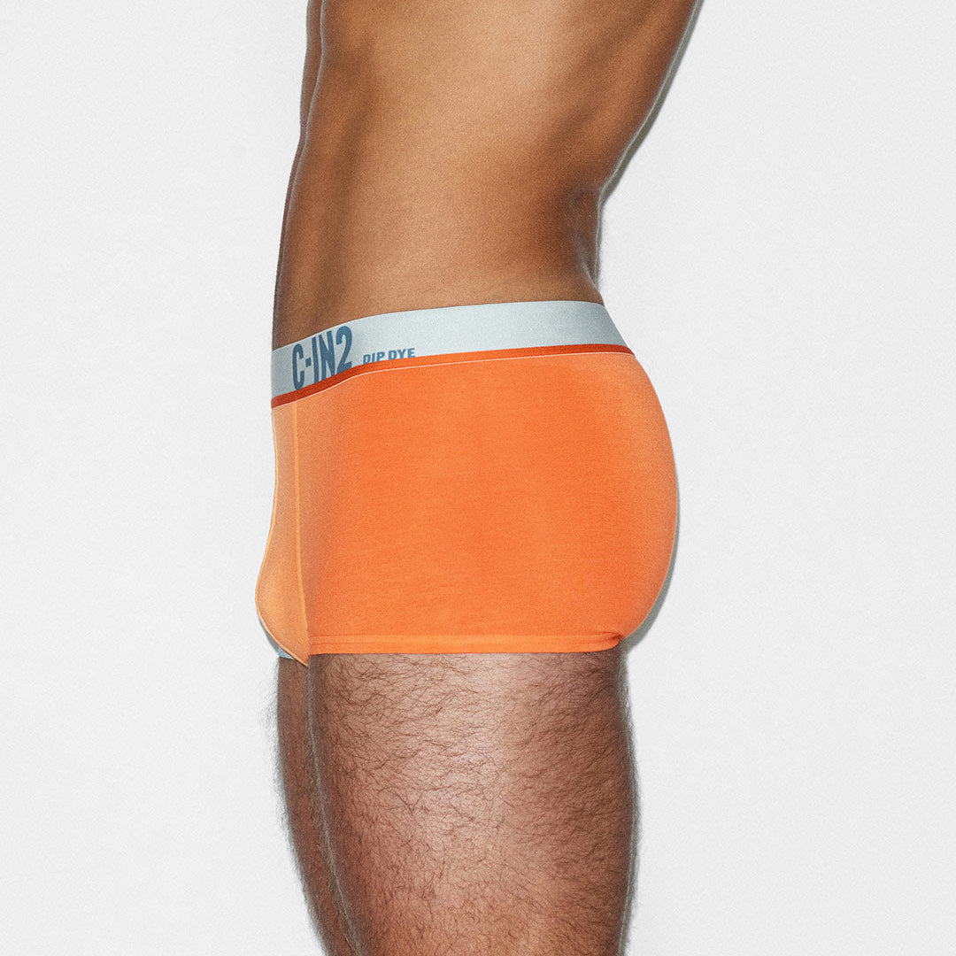 Orange underwear with a C-IN2 brand logo on a white background