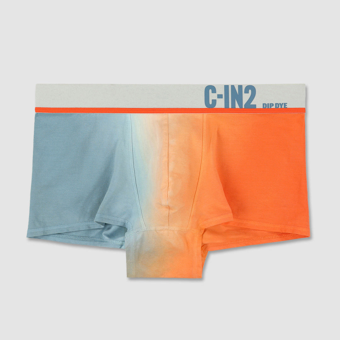 A pair of colorful boxer briefs with a gradient effect on a light gray background, featuring the brand 'C-IN2'.