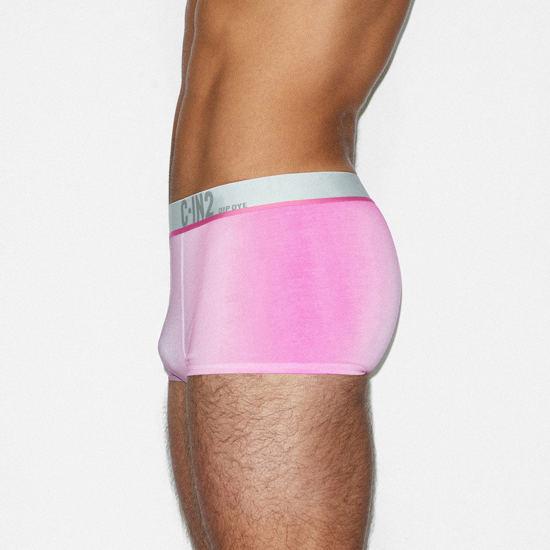 Pink underwear with a white C-IN2 branded waistband on a plain background