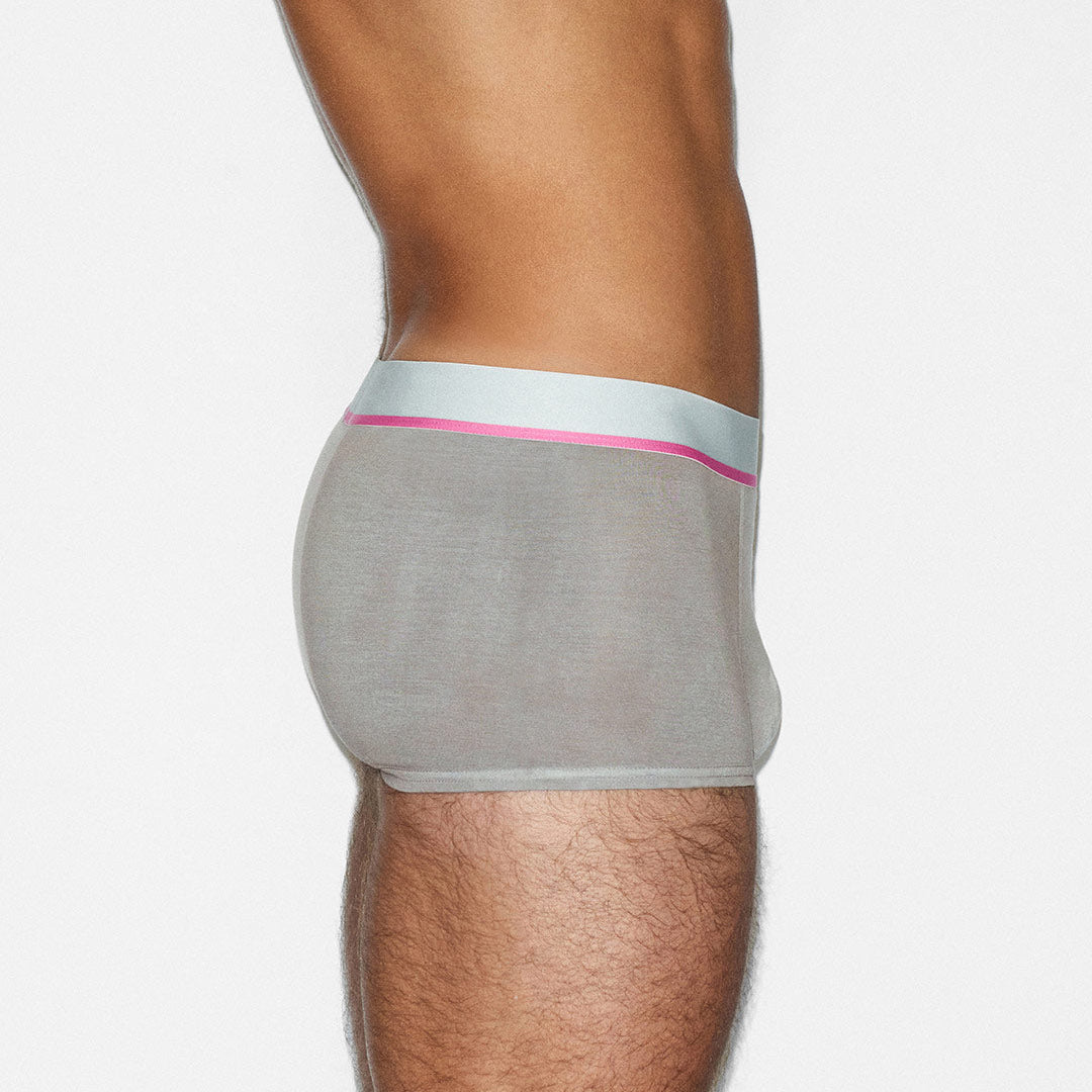 Gray underwear with a pink waistband on a white background