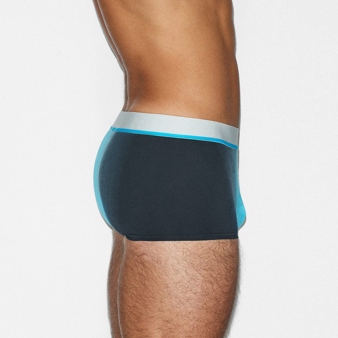 Teal underwear with light blue waistband on a white background