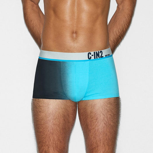 Man wearing a black and blue underwear set with a visible 'C-IN2' brand logo on a white background