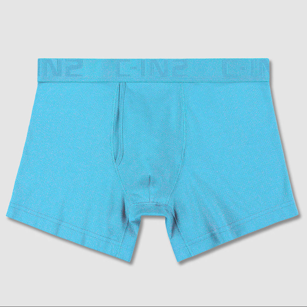 A pair of bright turquoise blue boxer briefs with a matching elastic waistband featuring a subtle embossed C-IN2 logo pattern, shown against a light gray background.
