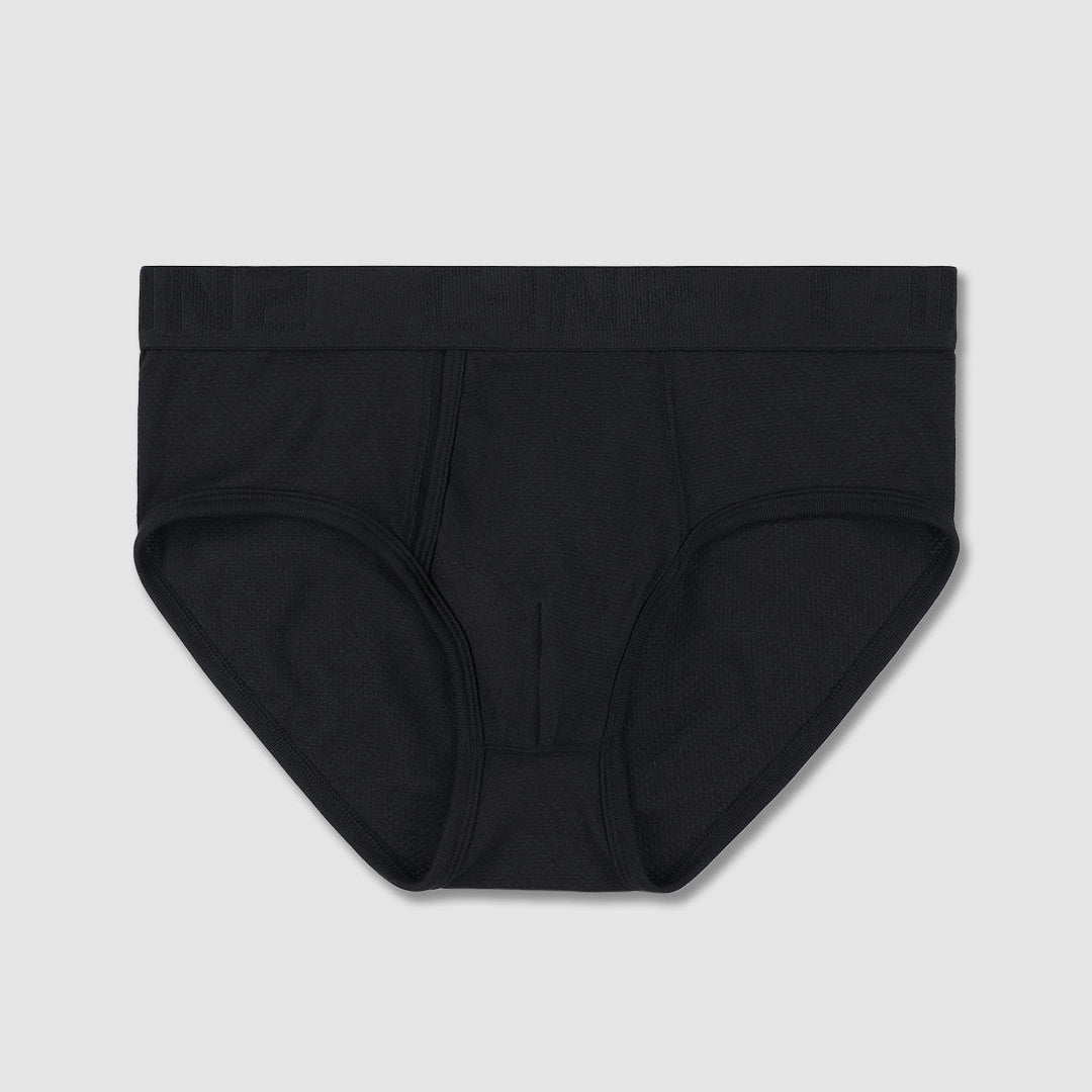 A pair of solid black men's briefs laid flat against a light gray background.