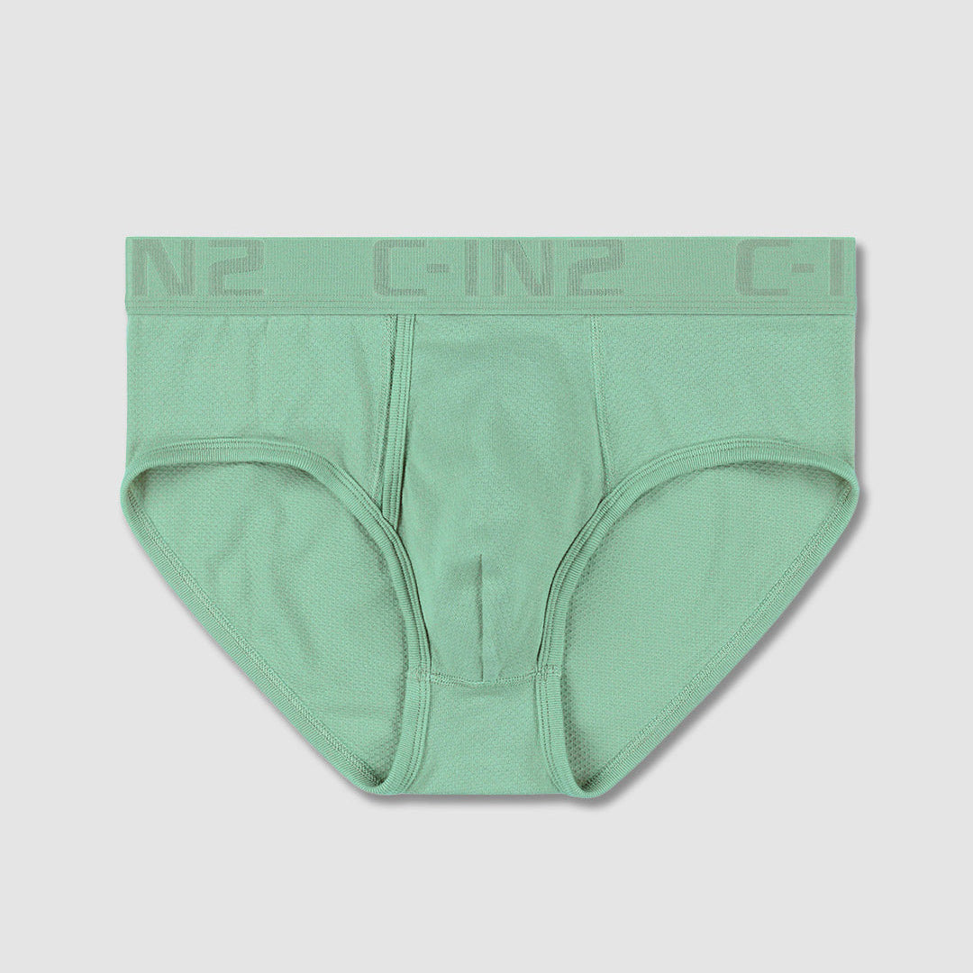 A pair of men's low-rise briefs in mint green, featuring a wide elastic waistband with the brand name 'C-IN2' printed in a matching tone.