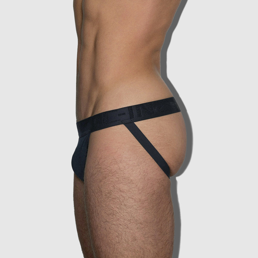 Black men's jockstrap on a plain background